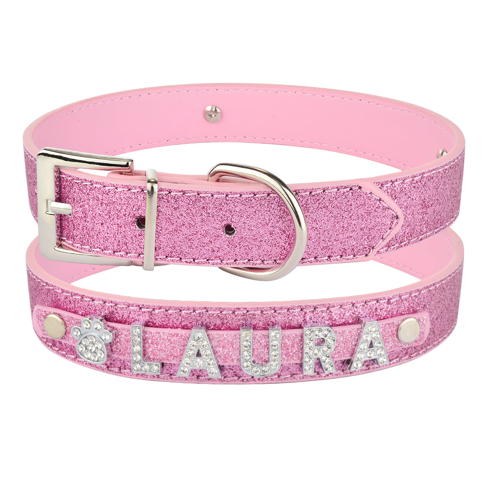 DIY alphabet dog collars featuring a pink sparkly design with personalized name 'LAURA' in rhinestones.