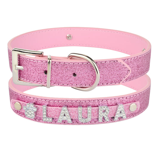 DIY alphabet dog collars featuring a pink sparkly design with personalized name 'LAURA' in rhinestones.